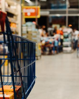 blue shopping cart on street during daytime